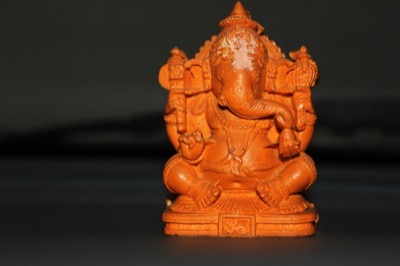 Small Ganesha idol on a car dashboard