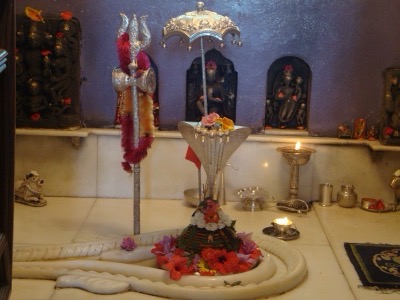 Shiva lingam in a spouted stone base